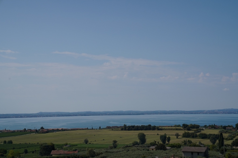 25 km further west, Lazise, near the  south end of lake Garda