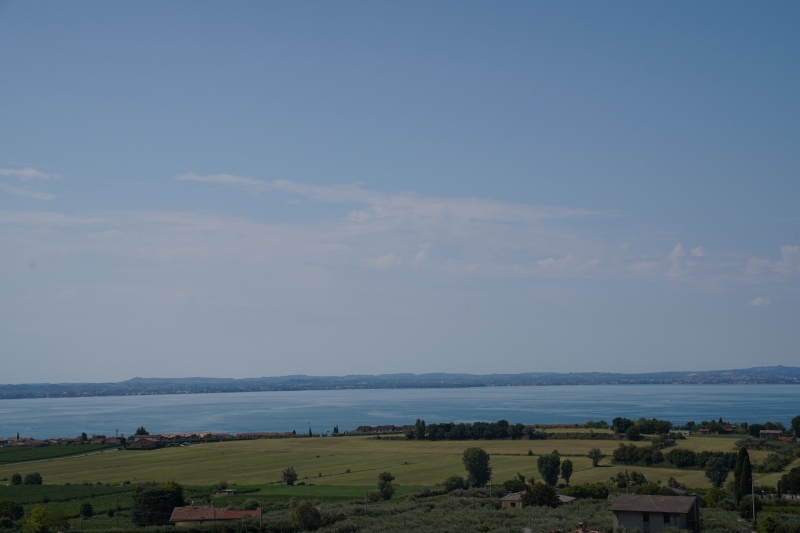 25 km further west, Lazise, near the  south end of lake Garda
