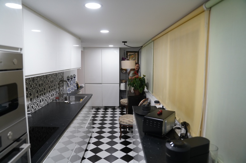 Kitchen with Narda smiling