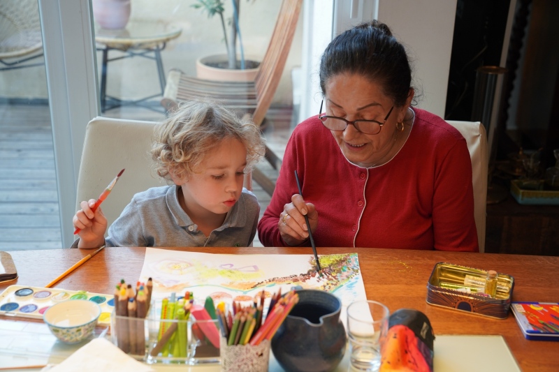 Leo painting with granny
